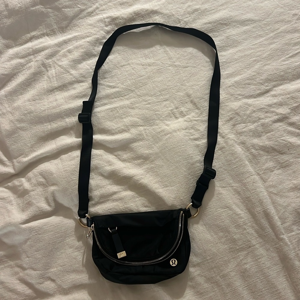 Lululemon black mini 2L All Night Festival bag. Gold hardware.